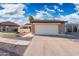 Home featuring a two-car garage, desert landscaping and brick accents on a sunny day at 4016 W Royal Palm Rd, Phoenix, AZ 85051