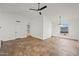 The living room is spacious and features a ceiling fan at 4016 W Royal Palm Rd, Phoenix, AZ 85051