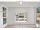 This living room offers an open window that gives great backyard views and natural light at 4016 W Royal Palm Rd, Phoenix, AZ 85051