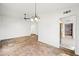 Open living space features a chandelier, ceiling fan, and great natural light at 4016 W Royal Palm Rd, Phoenix, AZ 85051