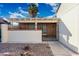 Covered outdoor patio with brick walls and tiled floor, offering a private and shaded space at 4016 W Royal Palm Rd, Phoenix, AZ 85051