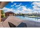 Community pool area with a lounge chair, pool house, and clear blue water, set under a blue sky with clouds at 4016 W Royal Palm Rd, Phoenix, AZ 85051