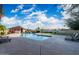 Community pool with seating and a pool house, all set in a well-kept area with a blue sky overhead at 4016 W Royal Palm Rd, Phoenix, AZ 85051
