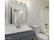 Cozy bathroom featuring a vanity with framed mirror, toilet, and shower over tub at 4031 W Lone Cactus Dr, Glendale, AZ 85308