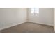 Neutral bedroom with a window bringing in natural light and complementing the carpeted flooring at 4031 W Lone Cactus Dr, Glendale, AZ 85308