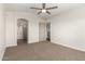 Bright bedroom with a ceiling fan and ensuite bathroom for added privacy and convenience at 4031 W Lone Cactus Dr, Glendale, AZ 85308