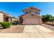 Two-story home featuring a two-car garage and well-maintained desert landscaping at 4031 W Lone Cactus Dr, Glendale, AZ 85308