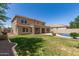 Spacious backyard featuring pool, grassy area, and covered patio at 4102 E Palm Beach Dr, Chandler, AZ 85249