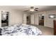 Bright bedroom showcases neutral walls, ceiling fan, and doorways to bathroom and closet at 4102 E Palm Beach Dr, Chandler, AZ 85249