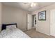Neutral bedroom featuring carpet, ceiling fan, and a whimsical print on the wall at 4102 E Palm Beach Dr, Chandler, AZ 85249