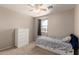 Bright bedroom featuring carpet, a ceiling fan, and closet space perfect for relaxation at 4102 E Palm Beach Dr, Chandler, AZ 85249