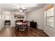 Charming dining area featuring a round table, wood-look flooring, a globe, and stylish furnishings at 4102 E Palm Beach Dr, Chandler, AZ 85249