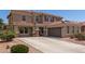 Stunning two-story home with a well-manicured front yard and a spacious driveway leading to a two-car garage at 4102 E Palm Beach Dr, Chandler, AZ 85249