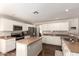 Modern kitchen featuring stainless steel appliances, granite countertops, white cabinetry, and a functional center island at 4102 E Palm Beach Dr, Chandler, AZ 85249