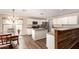 Bright kitchen with white cabinets, stainless steel appliances, a center island, and adjacent dining area at 4102 E Palm Beach Dr, Chandler, AZ 85249