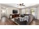 Cozy living room featuring a large sectional sofa, stylish decor, and great natural light from the surrounding windows at 4102 E Palm Beach Dr, Chandler, AZ 85249