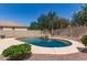 Backyard pool area with rock features surrounded by desert landscaping at 4102 E Palm Beach Dr, Chandler, AZ 85249
