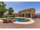 Sparkling pool with rock feature in a well-maintained backyard at 4102 E Palm Beach Dr, Chandler, AZ 85249
