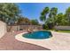Well-landscaped backyard featuring a pool with rock waterfall and lush landscaping at 4102 E Palm Beach Dr, Chandler, AZ 85249