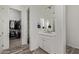 Bathroom with vanity, mirror, and walk-in closet at 4442 E Fairbrook St, Mesa, AZ 85205
