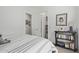 Bright bedroom features a large bed, bedside table and art providing comfort and style at 4442 E Fairbrook St, Mesa, AZ 85205