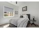 Light filled bedroom with a ceiling fan, natural light, and simple decor at 4442 E Fairbrook St, Mesa, AZ 85205