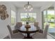 Cozy dining area featuring a round wooden table, comfortable chairs, and bright natural light at 4442 E Fairbrook St, Mesa, AZ 85205