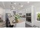 Bright, spacious kitchen with granite countertops, stainless steel appliances, and a center island with seating at 4442 E Fairbrook St, Mesa, AZ 85205