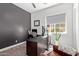Home office with lots of natural light, nice decor, and a large desk at 4442 E Fairbrook St, Mesa, AZ 85205
