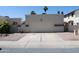 Exterior view of attached garage with mature landscaping and neutral color scheme at 4767 W Wahalla Ln, Glendale, AZ 85308