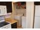 Kitchen includes modern appliances and adjacent laundry area at 4767 W Wahalla Ln, Glendale, AZ 85308