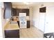 Spacious kitchen with modern appliances, dark cabinets and ample storage space at 4767 W Wahalla Ln, Glendale, AZ 85308