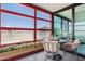 Relaxing balcony with colorful flowers, cozy chairs, and a table for outdoor enjoyment at 4808 N 24Th St # 1228, Phoenix, AZ 85016