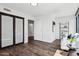 Cozy bedroom featuring a sliding glass closet, a storage shelf, and a comfortable couch at 4808 N 24Th St # 1228, Phoenix, AZ 85016