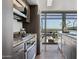 Modern kitchen showcasing stainless steel appliances, granite countertops, and a bright open layout at 4808 N 24Th St # 1228, Phoenix, AZ 85016