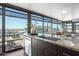 Modern kitchen with sink, granite countertop, stylish cabinets, and expansive city views through large windows at 4808 N 24Th St # 1228, Phoenix, AZ 85016
