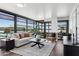 Bright living room featuring floor to ceiling windows and elegant contemporary furnishings at 4808 N 24Th St # 1228, Phoenix, AZ 85016