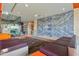 A contemporary lobby with stylish seating, artistic marble wall, and glass entryway at 4808 N 24Th St # 1228, Phoenix, AZ 85016
