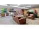 Common room with cozy lounge furniture, fireplace, and stairs leading up at 4808 N 24Th St # 1228, Phoenix, AZ 85016