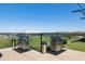 Rooftop deck featuring community grills, artificial grass, and distant mountain views at 4808 N 24Th St # 1228, Phoenix, AZ 85016