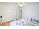 Bedroom with wood floors, closet, neutral paint, and fan at 4928 E Paradise Ln, Scottsdale, AZ 85254