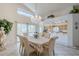 Formal dining room features modern light fixture and outdoor access at 4928 E Paradise Ln, Scottsdale, AZ 85254