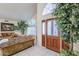 Bright entryway featuring tile floors, a wood door, and a large arched window providing plenty of natural light at 4928 E Paradise Ln, Scottsdale, AZ 85254