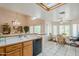 Bright open-concept kitchen area with tile countertops, wood cabinets, and clear view to the dining space at 4928 E Paradise Ln, Scottsdale, AZ 85254