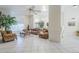 Spacious living room featuring an open layout, tile floors, bright lighting, and traditional, comfortable furniture at 4928 E Paradise Ln, Scottsdale, AZ 85254
