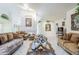 Large living room featuring tile floors, traditional furniture, and an open layout with high ceilings at 4928 E Paradise Ln, Scottsdale, AZ 85254