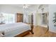 This is a spacious main bedroom with an ensuite and ceiling fan at 4928 E Paradise Ln, Scottsdale, AZ 85254