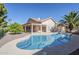Beautiful backyard showcasing a sparkling pool with a tiled patio, lush landscaping, and a tranquil ambiance at 4928 E Paradise Ln, Scottsdale, AZ 85254