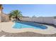 Sparkling pool with a surrounding patio and desert landscaping offers a refreshing oasis for relaxation and enjoyment at 4928 E Paradise Ln, Scottsdale, AZ 85254