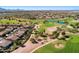 Golf course community aerial showcasing lush greens, meandering fairways, and beautiful homes with tile roofs at 5024 S Citrus Ct, Gilbert, AZ 85298